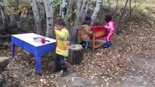 Cooking up ghost snacks in the mud kitchen